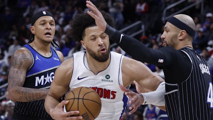 Apr 19, 2026; Detroit, Michigan, USA; Detroit Pistons guard Cade Cunningham (2) is defended by Orlando Magic guard Jalen Suggs (4) in the second half during the 2026 NBA Playoffs at Little Caesars Arena. Mandatory Credit: Rick Osentoski-Imagn Images