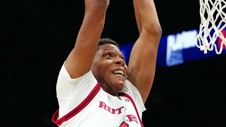 Nov 27, 2024; Las Vegas, Nevada, USA; Rutgers Scarlet Knights guard Ace Bailey (4) looks to dunk over Alabama Crimson Tide guard Labaron Philon (0) during the first half at MGM Grand Garden Arena. Mandatory Credit: Stephen R. Sylvanie-Imagn Images