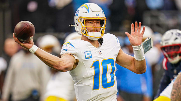 Dec 28, 2024; Foxborough, Massachusetts, USA; Los Angeles Chargers quarterback Justin Herbert (10) passes the ball against the New England Patriots in the third quarter at Gillette Stadium. Mandatory Credit: David Butler II-Imagn Images