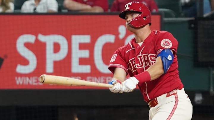Apr 24, 2026; Arlington, Texas, USA; Texas Rangers third baseman Josh Jung (6) hits an RBI double during the fourth inning against the Athletics at Globe Life Field. Mandatory Credit: Raymond Carlin III-Imagn Images