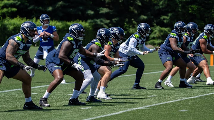 Seattle Seahawks offensive line units take part in drills during mini-camp at Virginia Mason Athletic Center. 