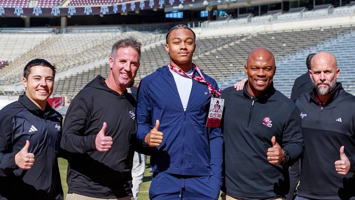 Texas A&M Aggies recruiting target Donald Tabron with the coaching staff Texas A&M Aggies recruiting target Donald Tabron with the coaching staff