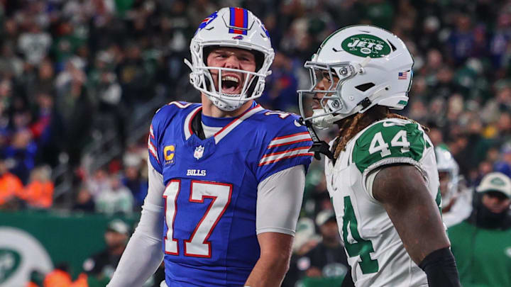 Buffalo Bills quarterback Josh Allen (17) yells at New York Jets linebacker Jamien Sherwood (44) after throwing a touchdown pass during the first half at MetLife Stadium.