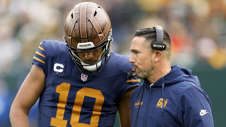 Nov 2, 2025; Green Bay, Wisconsin, USA; Green Bay Packers head coach Matt LaFleur talks to quarterback Jordan Love (10) during the second half against the Carolina Panthers at Lambeau Field. Mandatory Credit: Jeff Hanisch-Imagn Images