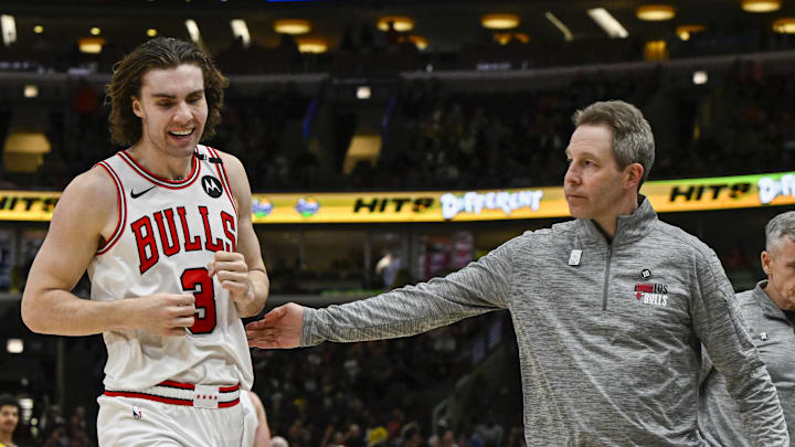 Mar 10, 2025; Chicago, Illinois, USA;  Chicago Bulls guard Josh Giddey (3) is helped off the court during the second half against the Indiana Pacers at United Center. Mandatory Credit: Matt Marton-Imagn Images
