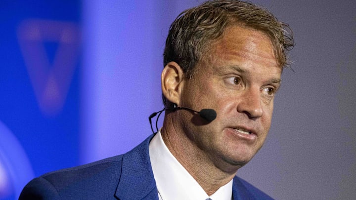 Ole Miss Rebels head coach Lane Kiffin talks with SEC Network personality Paul Finebaum (not pictured)
