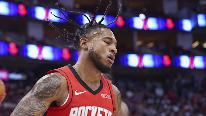 Oct 23, 2024; Houston, Texas, USA; Houston Rockets forward Cam Whitmore (7) reacts after scoring a basket past Charlotte Hornets guard Tre Mann (23) during the second quarter at Toyota Center. Mandatory Credit: Troy Taormina-Imagn Images