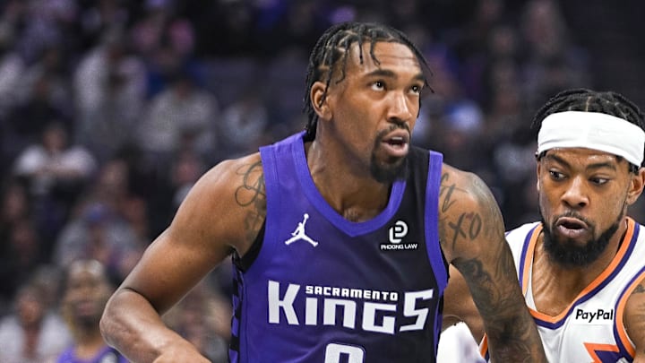 Nov 26, 2025; Sacramento, California, USA; Phoenix Suns guard Jordan Goodwin (23) defends against Sacramento Kings guard Malik Monk (0) during the second quarter at Golden 1 Center.