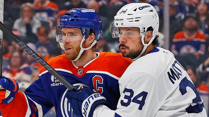 Feb 3, 2026; Edmonton, Alberta, CAN; Edmonton Oilers forward Connor McDavid (97) and Toronto Maple Leafs forward Auston Matthews (34) battle for position during the first period at Rogers Place. Mandatory Credit: Perry Nelson-Imagn Images