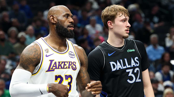 Apr 5, 2026; Dallas, Texas, USA;  Los Angeles Lakers forward LeBron James (23) and Dallas Mavericks forward Cooper Flagg (32) during the first half at American Airlines Center. Mandatory Credit: Kevin Jairaj-Imagn Images