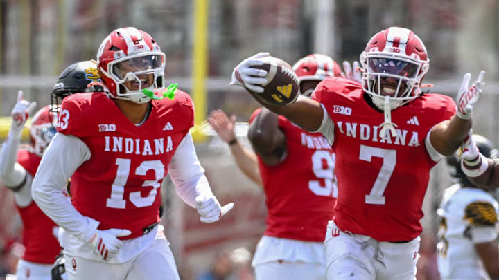 Sep 6, 2025; Bloomington, Indiana, USA; Indiana Hoosiers defensive lineman Kellan Wyatt (13) and defensive back Louis Moore (7) celebrate after forcing a turnover during the second half against the Kennesaw State Owls at Memorial Stadium. Mandatory Credit: Robert Goddin-Imagn Images Sep 6, 2025; Bloomington, Indiana, USA; Indiana Hoosiers defensive lineman Kellan Wyatt (13) and defensive back Louis Moore (7) celebrate after forcing a turnover during the second half against the Kennesaw State Owls at Memorial Stadium. Mandatory Credit: Robert Goddin-Imagn Images