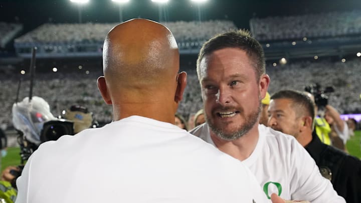 Sep 27, 2025; University Park, Pennsylvania, USA; Oregon Ducks head coach Dan Lanning greets Penn State Nittany Lions head coach James Franklin following a win over the Penn State Nittany Lions at Beaver Stadium. 