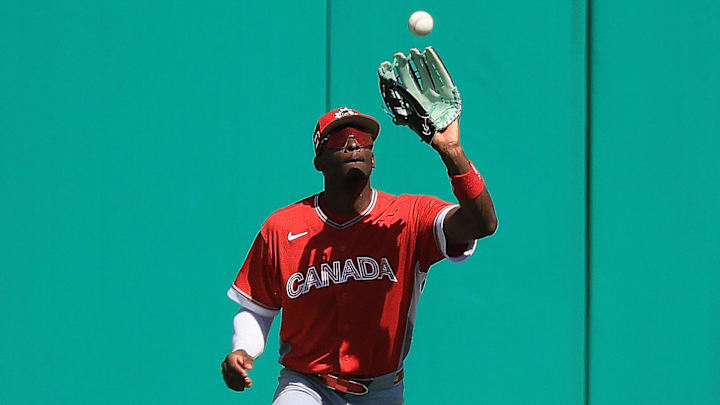 Mar 4, 2026; Clearwater, FL, USA; Canada outfielder Denzel Clarke (1) catches a fly ball during the third inning against the Philadelphia Phillies at BayCare Ballpark. Mandatory Credit: Kim Klement Neitzel-Imagn Images