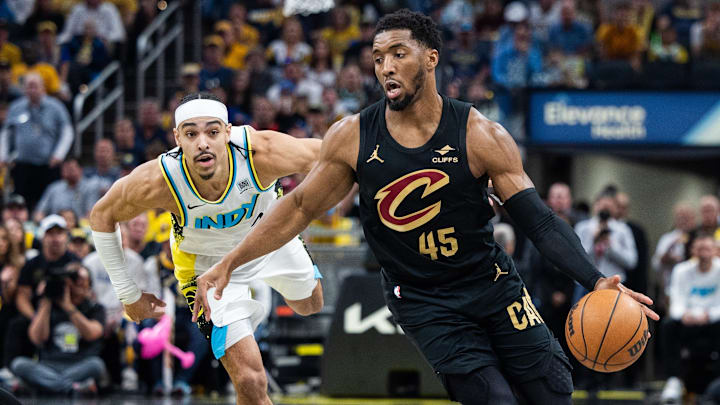 May 11, 2025; Indianapolis, Indiana, USA; Cleveland Cavaliers guard Donovan Mitchell (45) dribbles the ball while Indiana Pacers guard Andrew Nembhard (2) defends during game four of the second round for the 2025 NBA Playoffs at Gainbridge Fieldhouse. Mandatory Credit: Trevor Ruszkowski-Imagn Images May 11, 2025; Indianapolis, Indiana, USA; Cleveland Cavaliers guard Donovan Mitchell (45) dribbles the ball while Indiana Pacers guard Andrew Nembhard (2) defends during game four of the second round for the 2025 NBA Playoffs at Gainbridge Fieldhouse. Mandatory Credit: Trevor Ruszkowski-Imagn Images