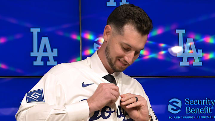 Jan 21, 2026; Los Angeles, CA, USA;  Los Angeles Dodgers right fielder Kyle Tucker (23) adjusts his jersey as he is introduced to the media during a press conference at Dodger Stadium. Mandatory Credit: Jayne Kamin-Oncea-Imagn Images