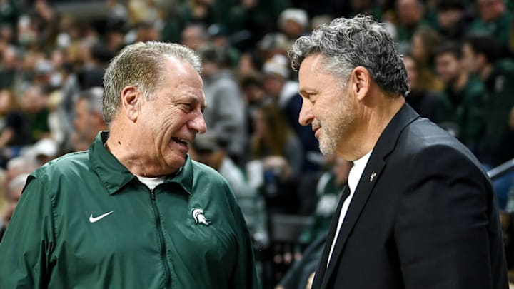 Michigan State's head coach Tom Izzo, left, talks with Oakland's head coach Greg Kampe before the game on Monday, Dec. 18, 2023, at the Breslin Center in East Lansing. \"They get their players going, the level of intensity just ratchets up and there's nothing you can do about it as a visiting player or team,\" Said Kampe of the Izzone impact.