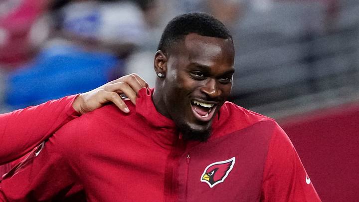 Arizona Cardinals running back Tyler Allgeier (center) jokes around with Jeremiyah Love (4) prior to a game at State Farm Stadium in Glendale on Aug. 22, 2026.