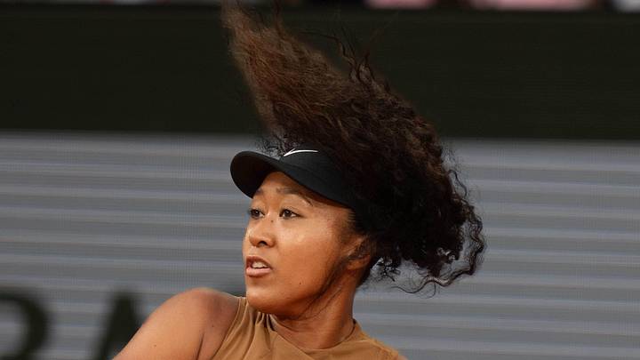 Naomi Osaka returns a shot during her match