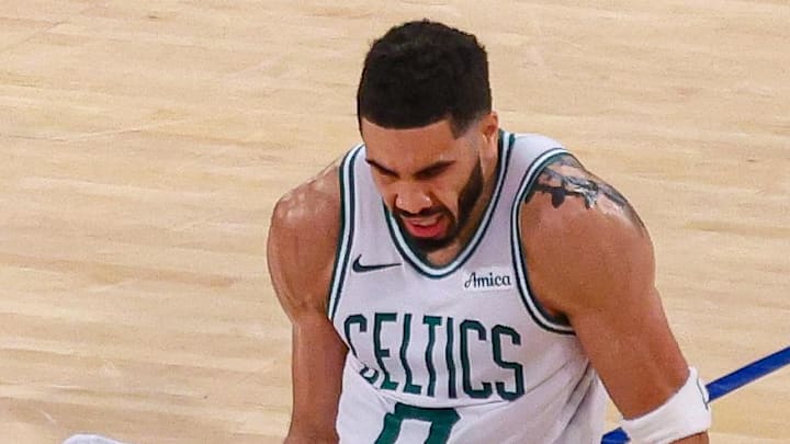 May 12, 2025; New York, New York, USA; New York Knicks forward OG Anunoby (8) rushes of the ball as Boston Celtics forward Jayson Tatum (0) reacts to an injury in the second half during game four of the second round for the 2025 NBA Playoffs at Madison Square Garden. Mandatory Credit: Vincent Carchietta-Imagn Images May 12, 2025; New York, New York, USA; New York Knicks forward OG Anunoby (8) rushes of the ball as Boston Celtics forward Jayson Tatum (0) reacts to an injury in the second half during game four of the second round for the 2025 NBA Playoffs at Madison Square Garden. Mandatory Credit: Vincent Carchietta-Imagn Images