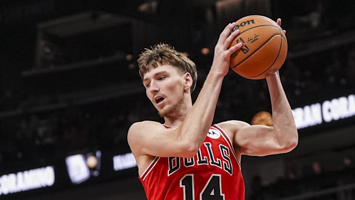 Nov 9, 2024; Atlanta, Georgia, USA; Chicago Bulls forward Matas Buzelis (14) gets a rebound against the Atlanta Hawks during the first half at State Farm Arena. Mandatory Credit: Dale Zanine-Imagn Images