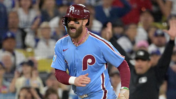 Oct 8, 2025; Los Angeles, California, USA; Philadelphia Phillies first baseman Bryce Harper (3) reacts as he scores a run during the fourth inning in game three of the NLDS against the Los Angeles Dodgers during the 2025 MLB playoffs at Dodger Stadium. Mandatory Credit: Jayne Kamin-Oncea-Imagn Images