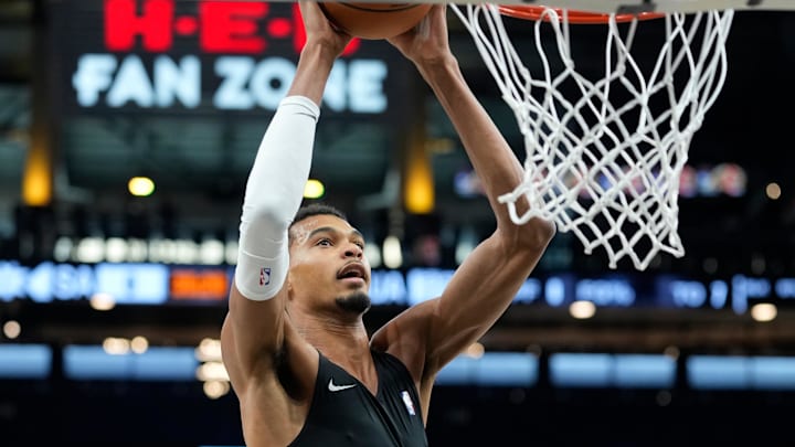 Oct 6, 2025; San Antonio, TX, USA; San Antonio Spurs forward-center Victor Wembanyama (1) warms up before a game against the Guangzhou Loong Lions at Frost Bank Center.