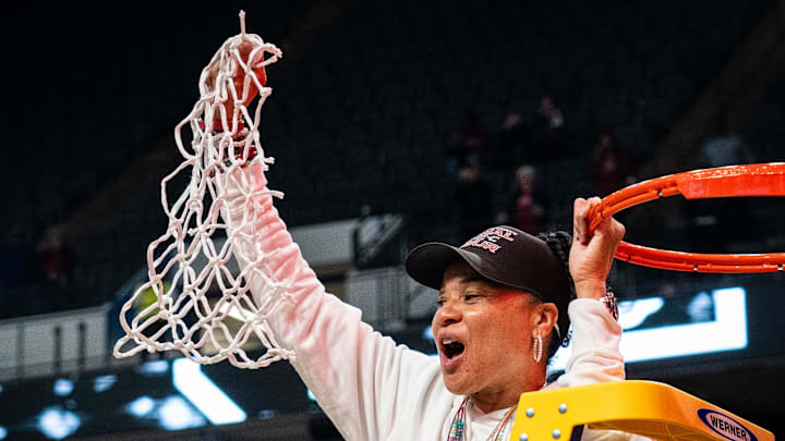 South Carolina Gamecocks head coach Dawn Staley cuts down the net at the Final Four.
