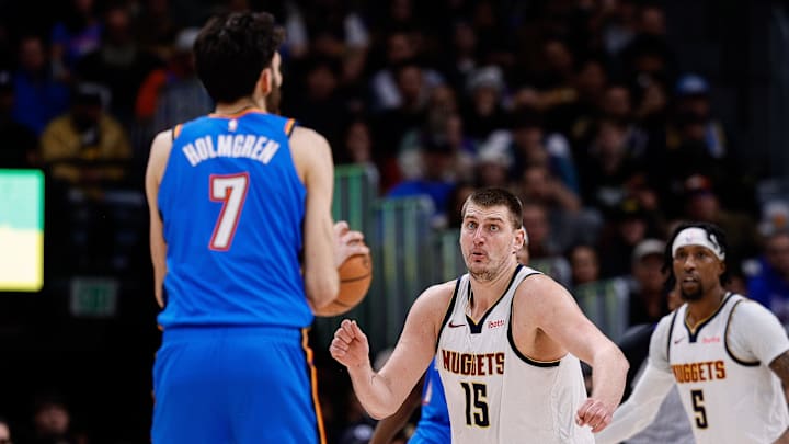 Dec 29, 2023; Denver, Colorado, USA; Denver Nuggets center Nikola Jokic (15) reacts as Oklahoma City Thunder forward Chet Holmgren (7) looks to shoot in the fourth quarter at Ball Arena. Mandatory Credit: Isaiah J. Downing-Imagn Images Dec 29, 2023; Denver, Colorado, USA; Denver Nuggets center Nikola Jokic (15) reacts as Oklahoma City Thunder forward Chet Holmgren (7) looks to shoot in the fourth quarter at Ball Arena. Mandatory Credit: Isaiah J. Downing-Imagn Images