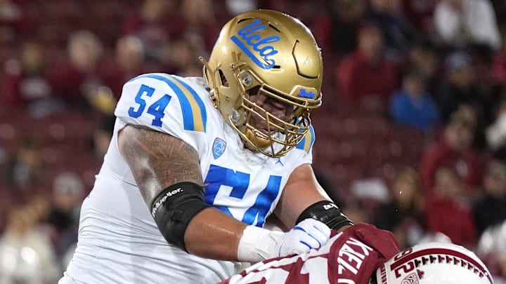 Oct 21, 2023; Stanford, California, USA; UCLA Bruins offensive lineman Josh Carlin (54) blocks Stanford Cardinal linebacker Lance Keneley (right) during the first quarter at Stanford Stadium. Mandatory Credit: Darren Yamashita-Imagn Images Oct 21, 2023; Stanford, California, USA; UCLA Bruins offensive lineman Josh Carlin (54) blocks Stanford Cardinal linebacker Lance Keneley (right) during the first quarter at Stanford Stadium. Mandatory Credit: Darren Yamashita-Imagn Images