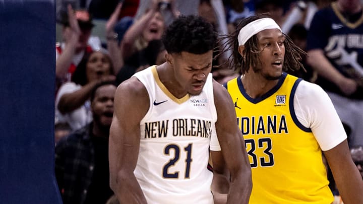 Nov 1, 2024; New Orleans, Louisiana, USA;  New Orleans Pelicans center Yves Missi (21) reacts to dunking the ball against Indiana Pacers center Myles Turner (33) during the second half at Smoothie King Center. Mandatory Credit: Stephen Lew-Imagn Images