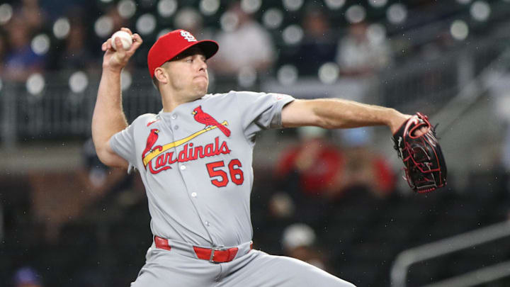 Apr 22, 2025; Cumberland, Georgia, USA; St. Louis Cardinals pitcher Ryan Helsley (56) pitches the ball against the Atlanta Braves during the ninth inning at Truist Park.