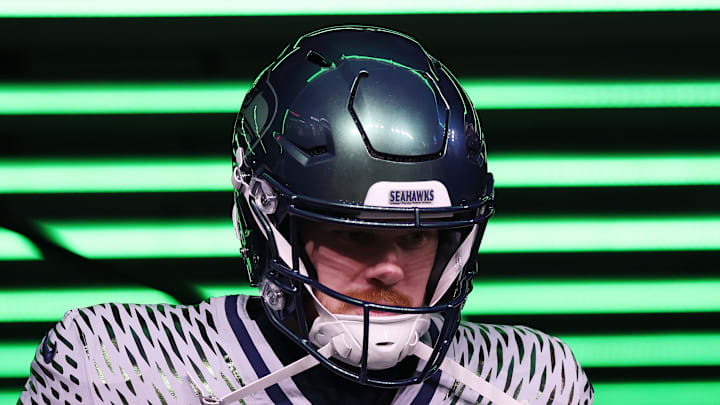 Sam Darnold of the Seattle Seahawks looks down