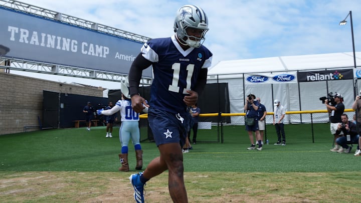 Former Penn State football and current Dallas Cowboys defensive end Micah Parsons enters the field during training camp.