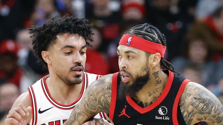 Chicago Bulls guard Tre Jones defends against Toronto Raptors forward Brandon Ingram.