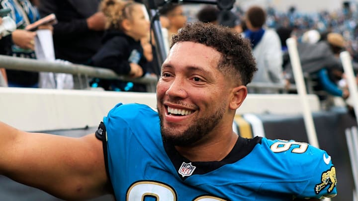 Jacksonville Jaguars defensive end Matt Dickerson (93) high-fives fans after the game of an NFL football matchup at EverBank Stadium, Sunday, Jan. 4, 2026, in Jacksonville, Fla. The Jaguars defeated the Titans 41-7, capturing the AFC South title. 