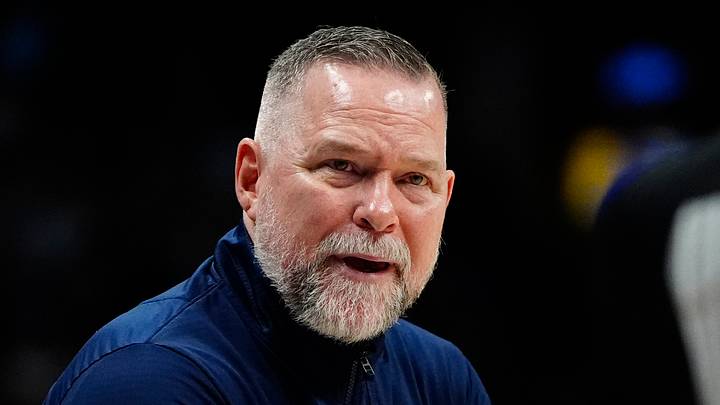 Apr 6, 2025; Denver, Colorado, USA; Denver Nuggets head coach Michael Malone reacts towards referee Danielle Scott (87) in the second half against the Indiana Pacers at Ball Arena. Mandatory Credit: Ron Chenoy-Imagn Images