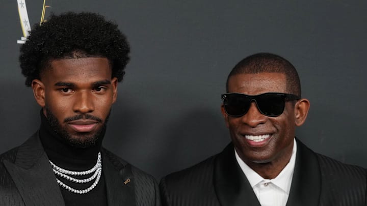 Feb 6, 2025; New Orleans, LA, USA;  Deion Sanders (right) with his son Shedeur Sanders on the red carpet before Super Bowl LIX NFL Honors at Saenger Theatre. Mandatory Credit: Kirby Lee-Imagn Images