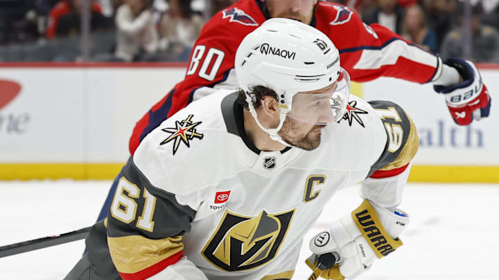 Feb 27, 2026; Washington, District of Columbia, USA; Vegas Golden Knights right wing Mark Stone (61) skates with the puck as Washington Capitals left wing Pierre-Luc Dubois (80) /chases during the first period at Capital One Arena. Mandatory Credit: Geoff Burke-Imagn Images