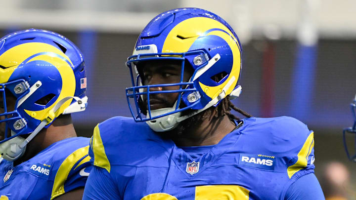 Oct 6, 2024; Inglewood, California, USA; Los Angeles Rams defensive tackle Neville Gallimore (92), defensive tackle Kobie Turner (91) and Rams defensive tackle Bobby Brown III (95) during the second quarter against the Green Bay Packers  at SoFi Stadium. Mandatory Credit: Robert Hanashiro-Imagn Images