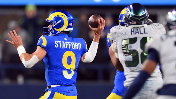 Dec 18, 2025; Seattle, Washington, USA; Los Angeles Rams quarterback Matthew Stafford (9) throws a pass against the Seattle Seahawks in the first half at Lumen Field. Mandatory Credit: Steven Bisig-Imagn Images