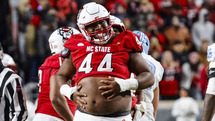 Nov 29, 2025; Raleigh, North Carolina, USA;  NC State Wolfpack defensive tackle Brandon Cleveland (44) reacts to his tackle during the first half of the game against the North Carolina Tar Heels at Carter-Finley Stadium.  Mandatory Credit: Jaylynn Nash-Imagn Images