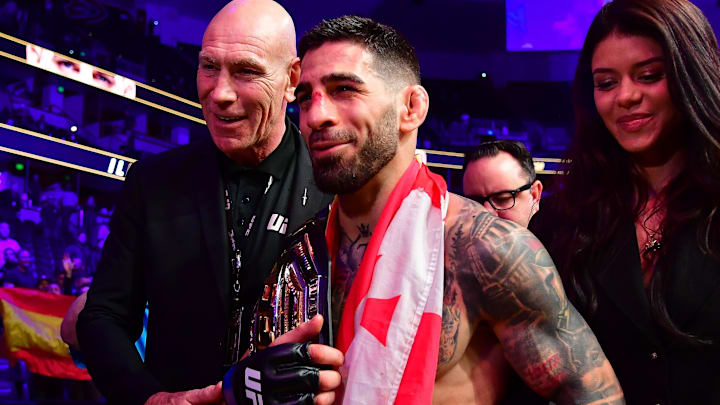 Feb 17, 2024; Anaheim, California, USA; Ilia Topuria celebrates his championship victory against Alexander Volkanovski during UFC 298 at Honda Center. Mandatory Credit: Gary A. Vasquez-Imagn Images Feb 17, 2024; Anaheim, California, USA; Ilia Topuria celebrates his championship victory against Alexander Volkanovski during UFC 298 at Honda Center. Mandatory Credit: Gary A. Vasquez-Imagn Images