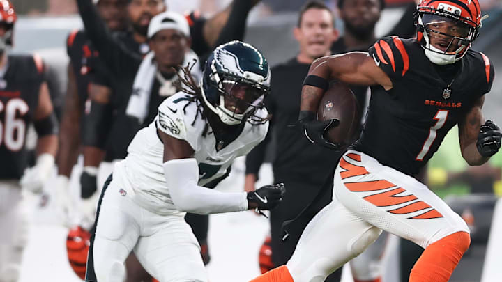 Aug 7, 2025; Philadelphia, Pennsylvania, USA; Cincinnati Bengals wide receiver Ja'Marr Chase (1) runs for a touchdown past Philadelphia Eagles cornerback Kelee Ringo (7) after a catch during the first quarter at Lincoln Financial Field. Mandatory Credit: Bill Streicher-Imagn Images