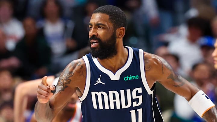 Dallas Mavericks guard Kyrie Irving (11) reacts after scoring during the first half against the Oklahoma City Thunder at American Airlines Center. Mandatory Credit: Kevin Jairaj-Imagn Images
