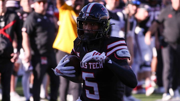 Texas Tech's Caleb Douglas runs after a catch against UCF during a Big 12 Conference football game, Saturday, Nov. 15, 2025, at Jones AT&T Stadium. Texas Tech's Caleb Douglas runs after a catch against UCF during a Big 12 Conference football game, Saturday, Nov. 15, 2025, at Jones AT&T Stadium.