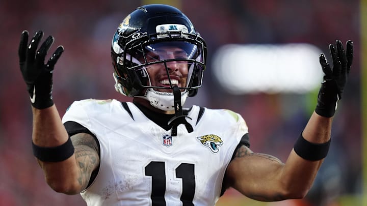 Dec 21, 2025; Denver, Colorado, USA; Jacksonville Jaguars wide receiver Parker Washington (11) reacts after making a catch for a touchdown against the Denver Broncos during the second half at Empower Field at Mile High. Mandatory Credit: Ron Chenoy-Imagn Images