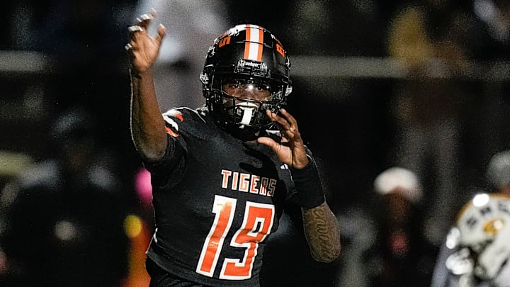 Belleville quarterback Bryce Underwood makes a pass against Saline during the first half of a district final playoff game at Belleville High School in Belleville on Friday, Nov. 8, 2024.