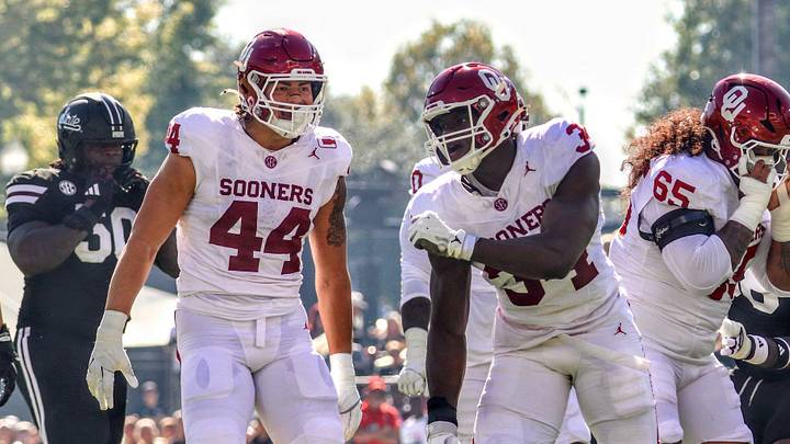 Oklahoma defensive end Adepoju Adebawore celebrates with Taylor Wein after logging a sack against MSU.