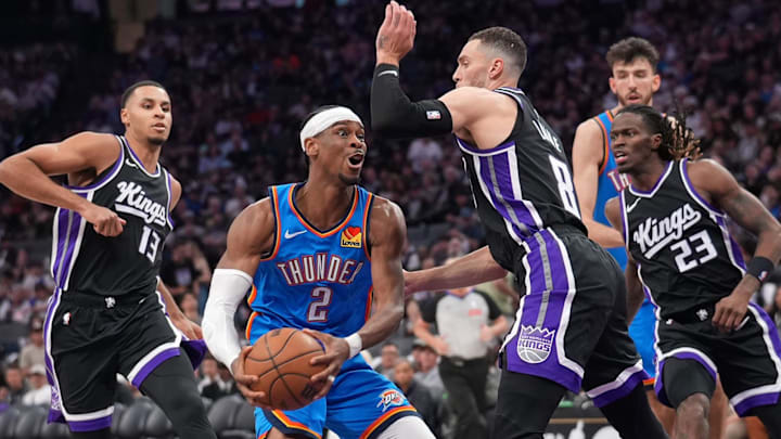 Mar 25, 2025; Sacramento, California, USA; Oklahoma City Thunder guard Shai Gilgeous-Alexander (2) drives to the hoop next to Sacramento Kings guard Zach LaVine (8) in the third quarter at the Golden 1 Center. Mandatory Credit: Cary Edmondson-Imagn Images Mar 25, 2025; Sacramento, California, USA; Oklahoma City Thunder guard Shai Gilgeous-Alexander (2) drives to the hoop next to Sacramento Kings guard Zach LaVine (8) in the third quarter at the Golden 1 Center. Mandatory Credit: Cary Edmondson-Imagn Images