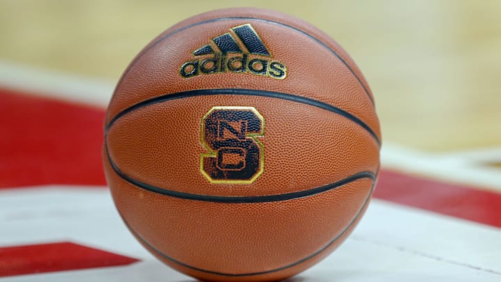 Feb 20, 2019; Raleigh, NC, USA; Basketball with the North Carolina State Wolfpack logo sits on the court during a timeout as the Wolfpack play the Boston College Eagles in the first half at PNC Arena. The North Carolina State Wolfpack won 89-80. Mandatory Credit: Nell Redmond-Imagn Images